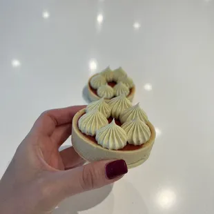 a person holding a pastry