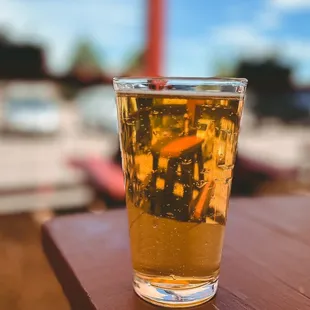 a glass of beer on a table