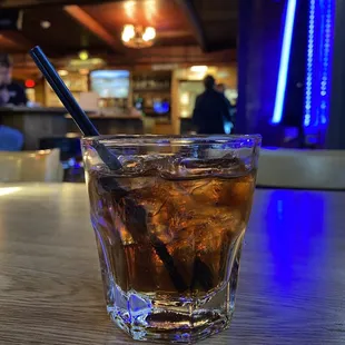 a drink in a glass on a table