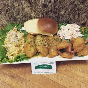 Fish Francéis, paired with brioche bun, fried shrimp, Italian Mac n'cheese, and creamy coleslaw