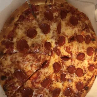 a pepperoni pizza in a box