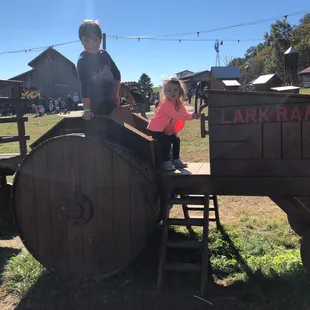 Wooden tractor in a park play area.