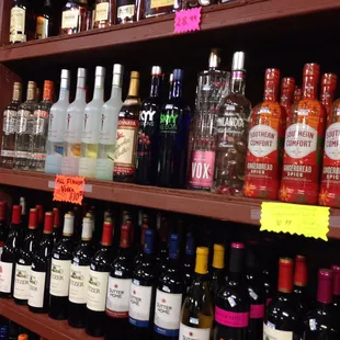 a shelf of liquor bottles