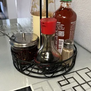 Soy sauce, sriracha, pepper, chili sauce, and hoisin