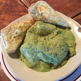 Stuffed shells with pesto cream sauce and garlic bread!