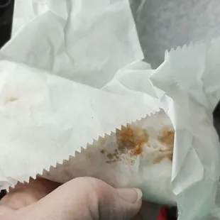 a hand holding a piece of food