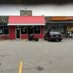  motorcycle parked in front of the restaurant