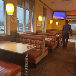 a man walking through the restaurant