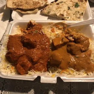 Chicken Tikka Masala and Butter Chicken on a order of rice with some garlic and butter Nan.