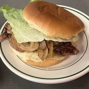 Ribeye sandwich dressed with others grilled onions