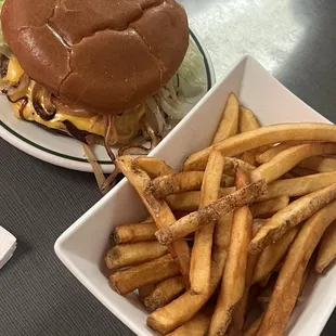 Original cheeseburger dressed with grilled onions and fresh cut fries