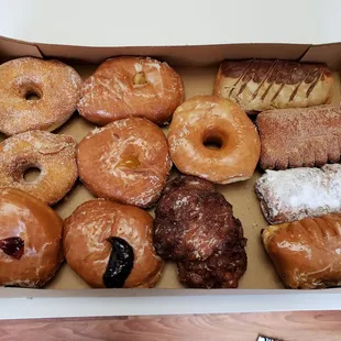 Sugar, apple and blueberry filled, glaze, blueberry fritter, maple bar, apple-filled bear claw with cinnamon sugar and two more bear claws