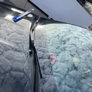 Windshield arms replaced incorrectly by mobile windshield repair company before Larry Miller service center correctly fixed them.