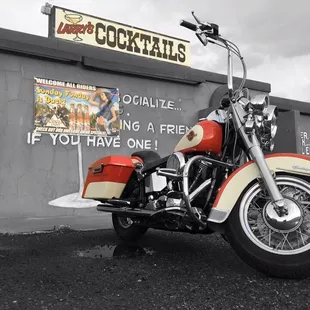 a motorcycle parked in front of a restaurant