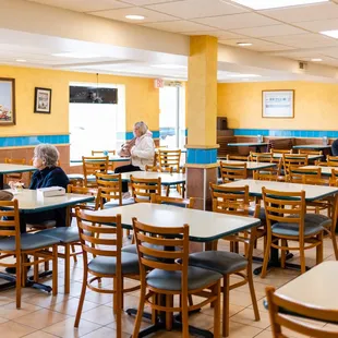 dining area with tables and chairs