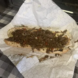 a sandwich with meat and cheese