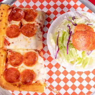 a slice of pepperoni pizza and a salad