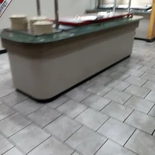 Food bits dropped all over pizza bar not kept clean.