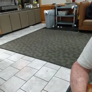 Trash in floor all around soda fountain