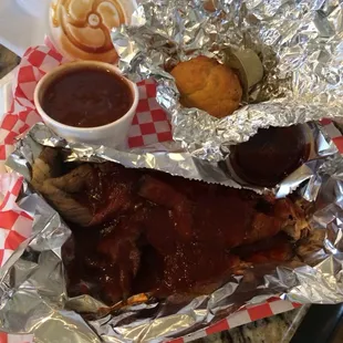 BBQ brisket dinner with beans and cornbread.