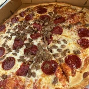 large pizza with pepperoni and sausage