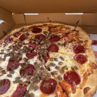 large pizza with pepperoni and sausage