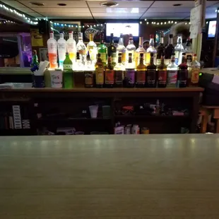 a bar with bottles of alcohol