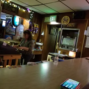 a woman sitting at a bar