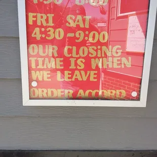 Funny Display sign showing the hours.