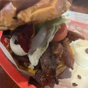 Bacon cheeseburger with lettuce, Tomato, onion and pickle