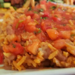 Rice and beans mixed topped with salsa