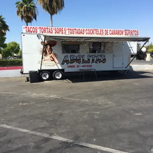 a taco truck parked in a parking lot