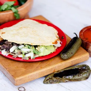 a tortilla on a red plate