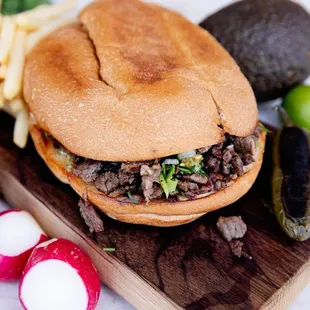 a beef sandwich on a cutting board