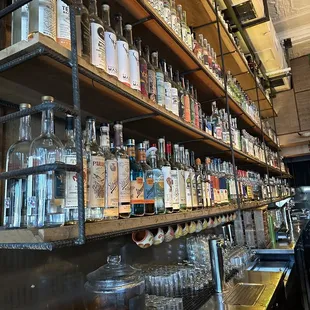 a shelf of liquor bottles