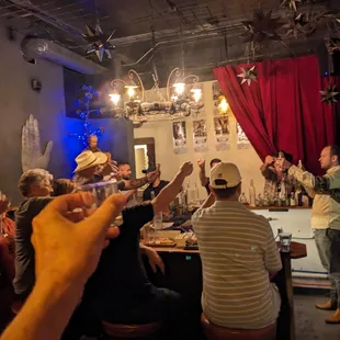 a group of people at a bar