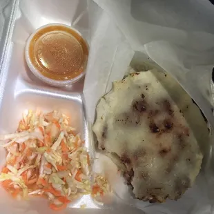 I took a bite and realized I needed to document. 2 rice beans and cheese pupusas, slaw, hot sauce for 7$