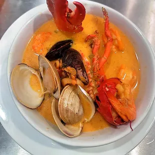 a bowl of seafood and clams