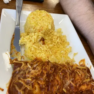Red enchiladas and light turmeric rice.