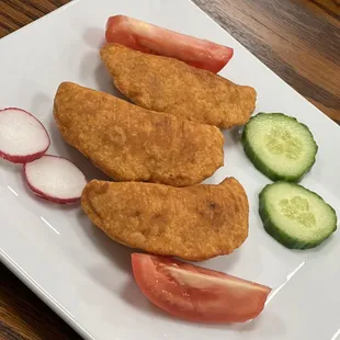 Three Pastelitos (filled with ground beef and vegetables)