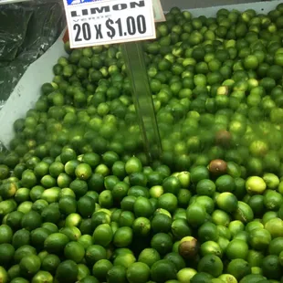 a display of limes in a grocery store