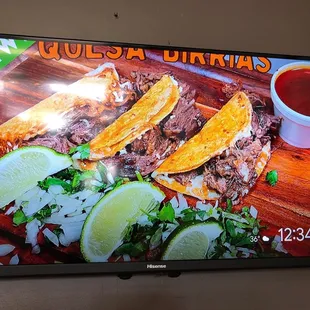 a television screen displaying a menu