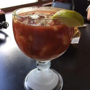 Shrimp cocktail avocado on the side. Chilled cup.