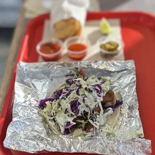 Baja Crispy Fish Taco: Battered Wild-Caught Rock Fish, Cabbage, Pico De Gallo &amp; Cream Sauce Served w/Chips &amp; Salsa | $3.99