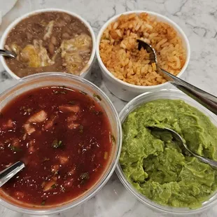 Sides of beans and rice. Half pint guacamole. Full pint salsa. Side of salsa is fresher than the little complimentary containers.
