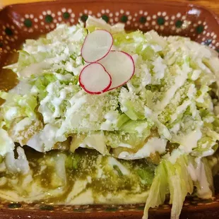 Enchiladas de carne asada w/salsa verde. Shredded iceberg lettuce, radish garnish, queso fresca - no rice &amp; beans. ($22.99, 10/15/23)