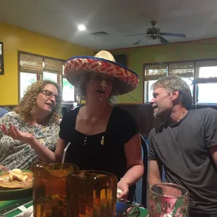 a group of people sitting at a table