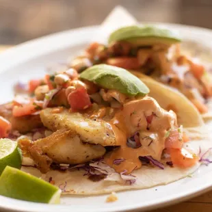 Baja Fish Taco:
Grilled or fried fish served in a flour tortilla with cabbage, pico de gallo, special sauce, and sliced avocado!
