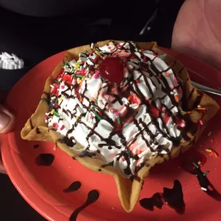 a person holding a plate of food