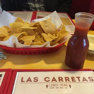 Complimentary chips and salsa in a carafe, cute!